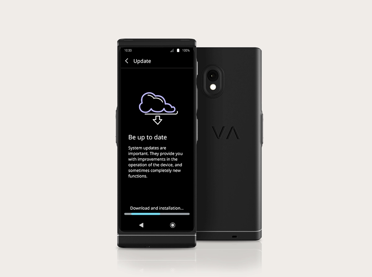 A studio product photo of the Vasco Translator V4 showing the system update interface. Two black devices are positioned side-by-side: one facing forward and one showing the back. The screen displays a cloud icon with a download arrow, the heading 